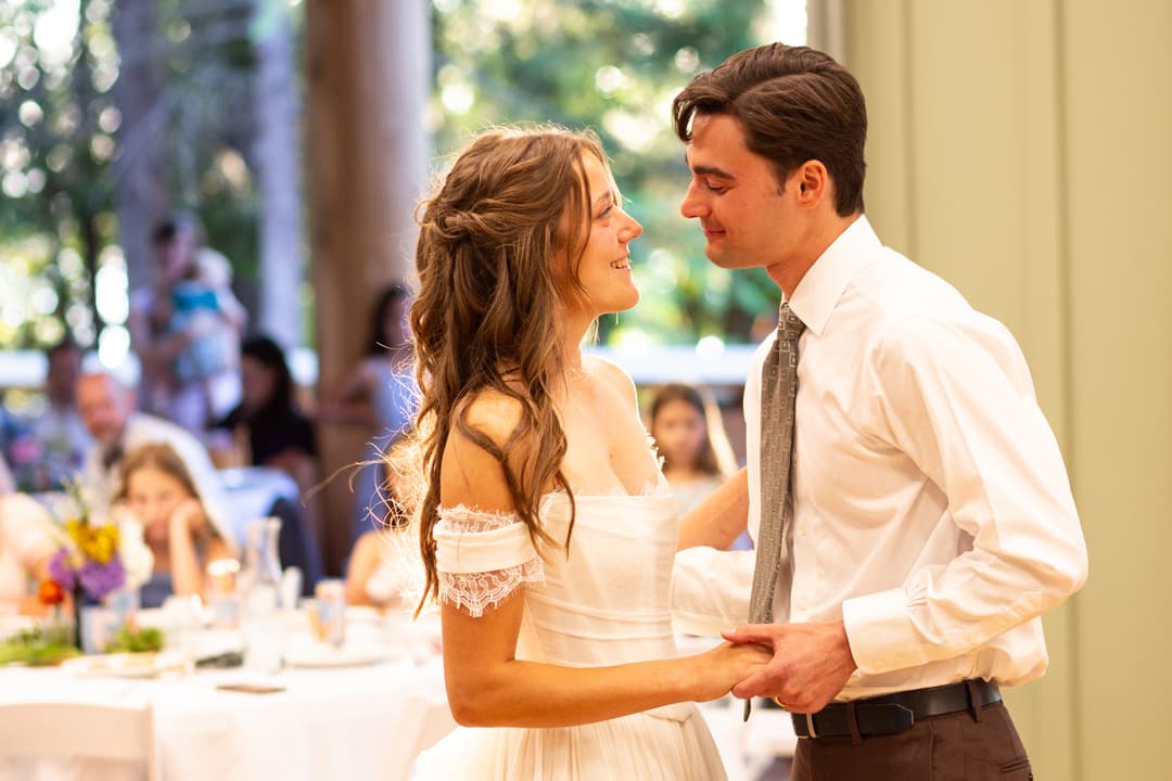 a bride and groom looking at each other